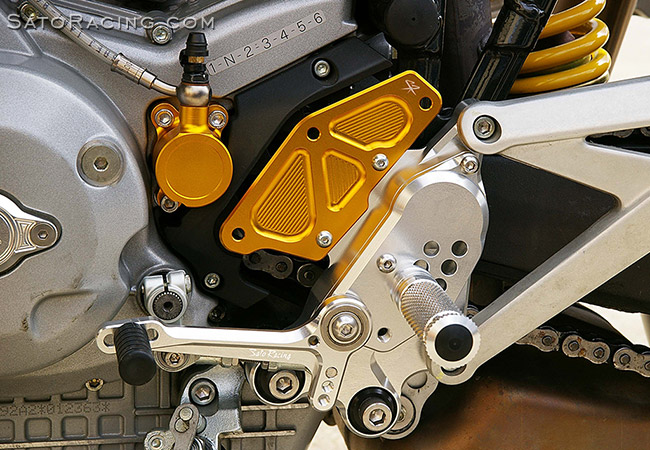 SATO RACING Rear Sets with Sprocket Cover on a Multistrada