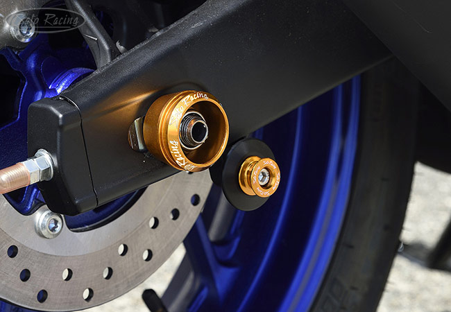 SATO RACING type 2 aluminum Swingarm Spools with Delrin backing rings and matching Axle Caps on a Yamaha R3