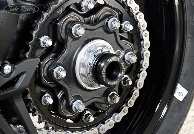 SATO RACING Rear Axle Sliders on a Speed Triple RR