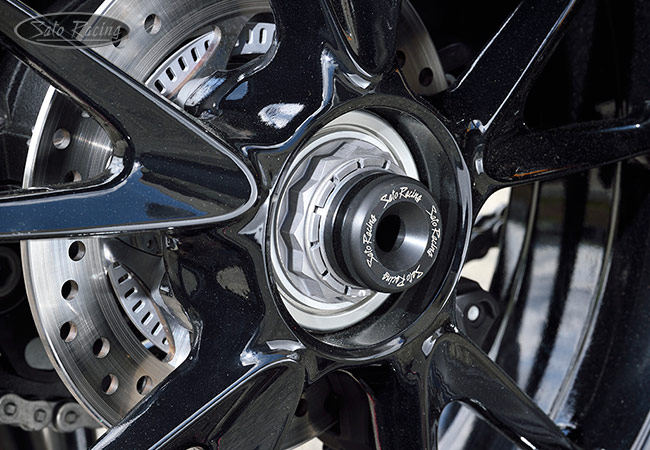 SATO RACING Rear Axle Sliders on a Speed Triple RR